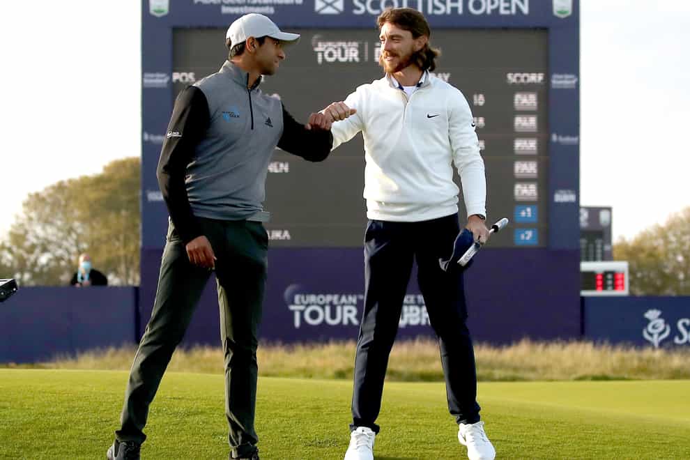 Aaron Rai (left) celebrates with Tommy Fleetwood after winning the play-off at the Scottish Open
