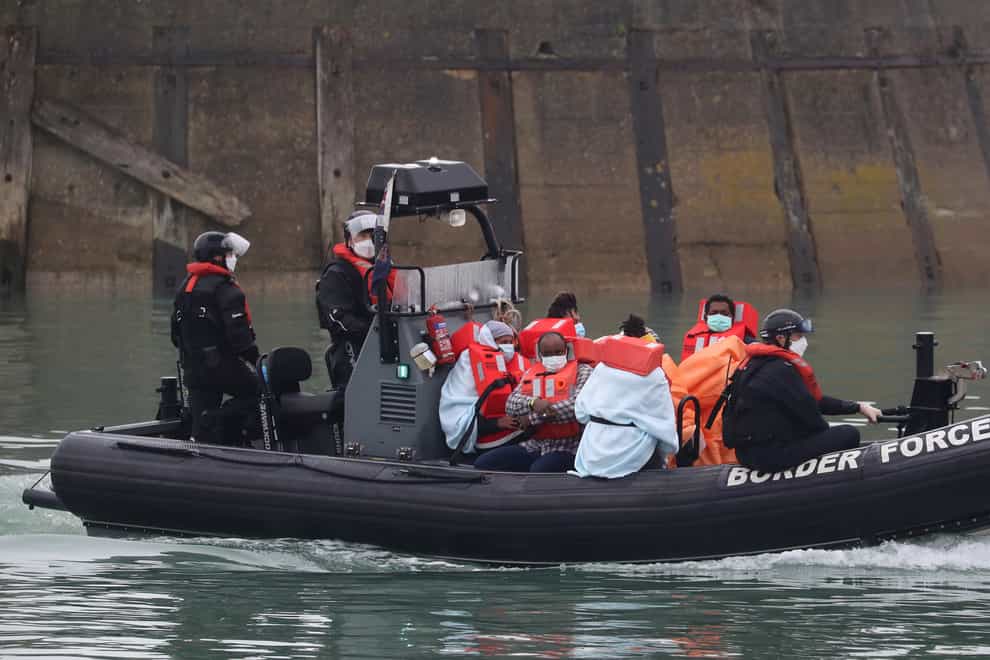 A group of people thought to be migrants are taken into Dover