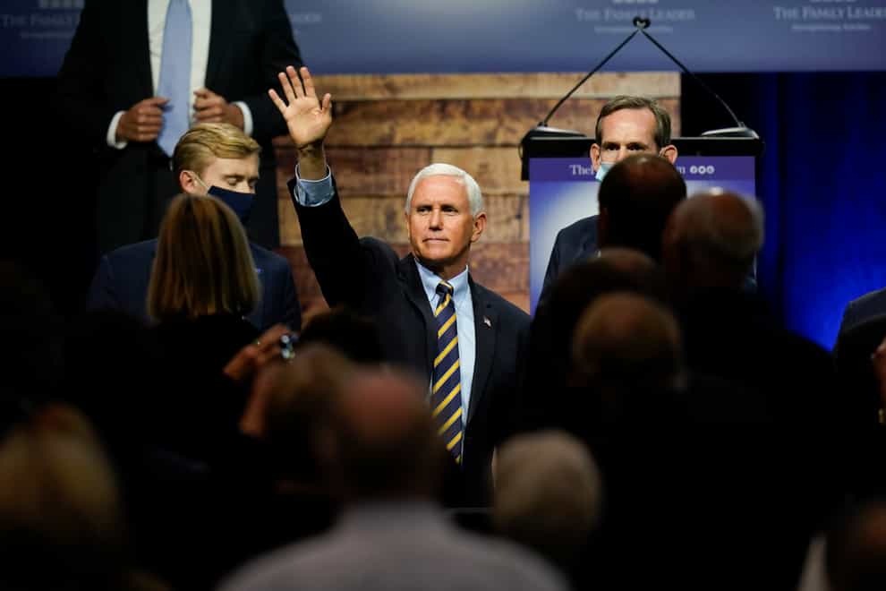 Vice President Mike Pence waves to supporters after speaking in Des Moines, Iowa (Charlie Neibergall/AP)