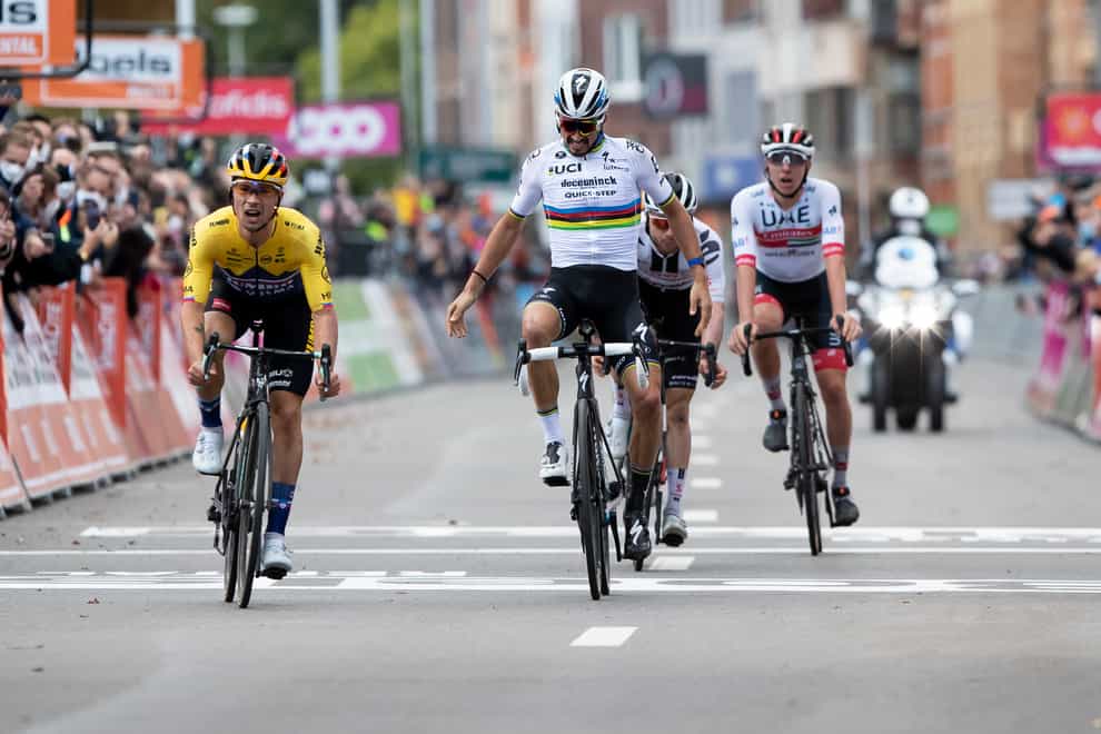 Roglic (left) pipped Alaphilippe when the Frenchman threw his hands in the air