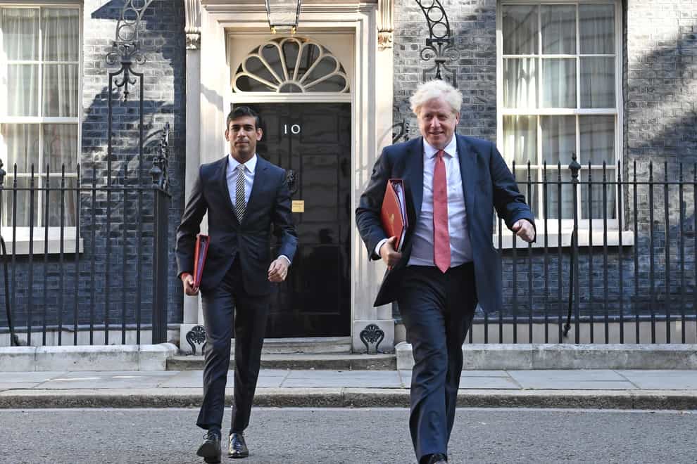 Chancellor of the Exchequer Rishi Sunak (left) and Prime Minister Boris Johnson leave 10 Downing Street, for a Cabinet meeting (Stefan Rousseau/PA)