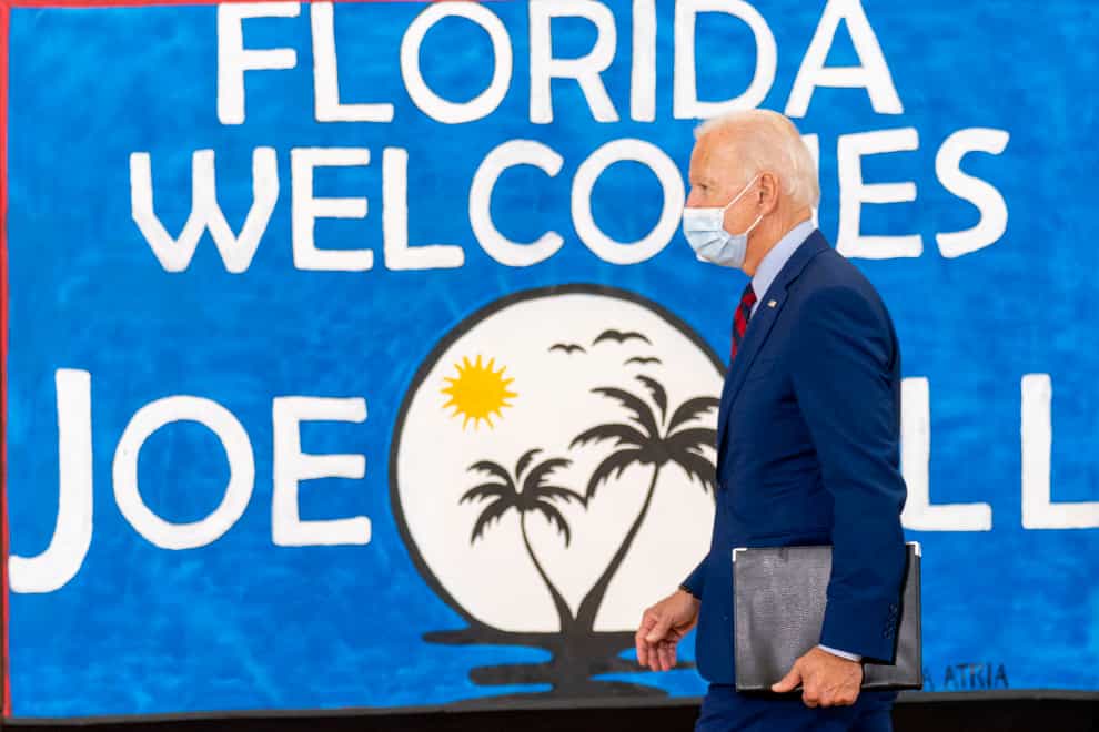 Democratic presidential candidate former vice president Joe Biden leaves after speaking at Jose Marti Gym in Miami. (Andrew Harnik/AP)