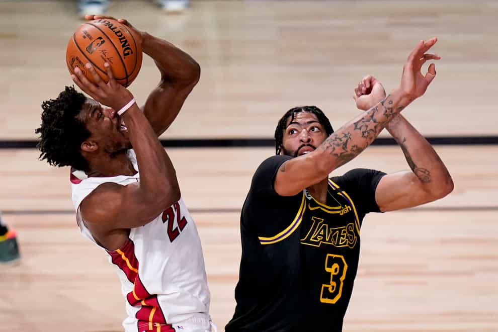 Miami Heat forward Jimmy Butler shoots over Los Angeles Lakers forward Anthony Davis