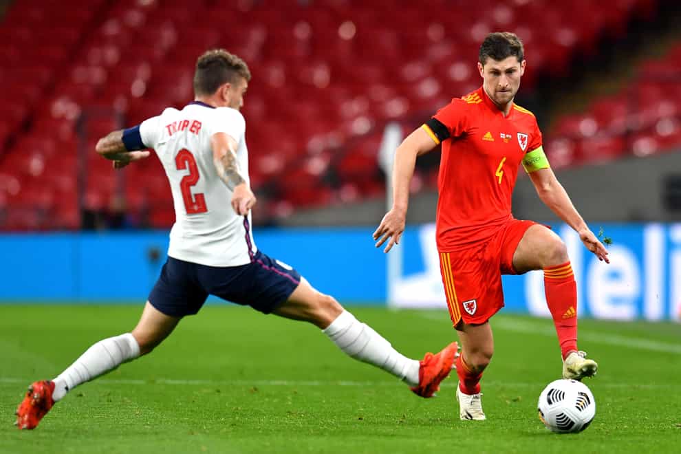 Wales's Ben Davies, right, in action against England