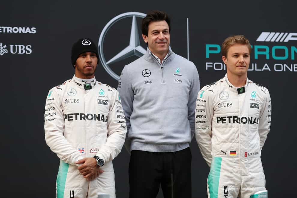 Nico Rosberg, right, has warned Lewis Hamilton, left, as questions remain over the future of Toto Wolff, centre, at Mercedes