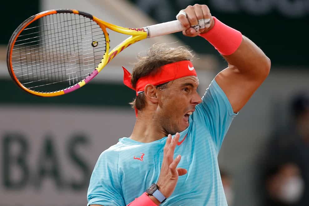 Rafael Nadal hits a forehand on his way to a 13th French Open title