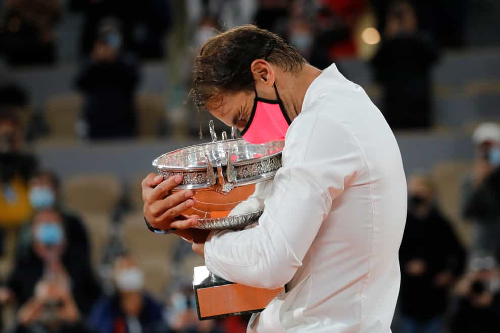 Rafael Nadal embraces the Coupe des Mousquetaires