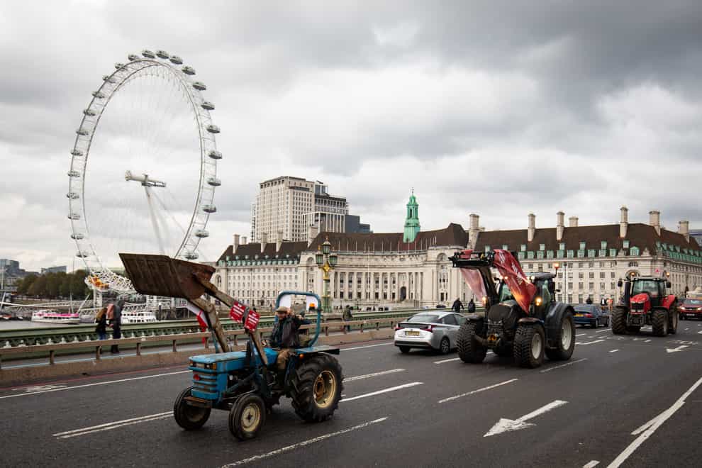 Farmers in tractors take part in a protest over food and farming standards, organised by Save British Farming, at Westminster, London