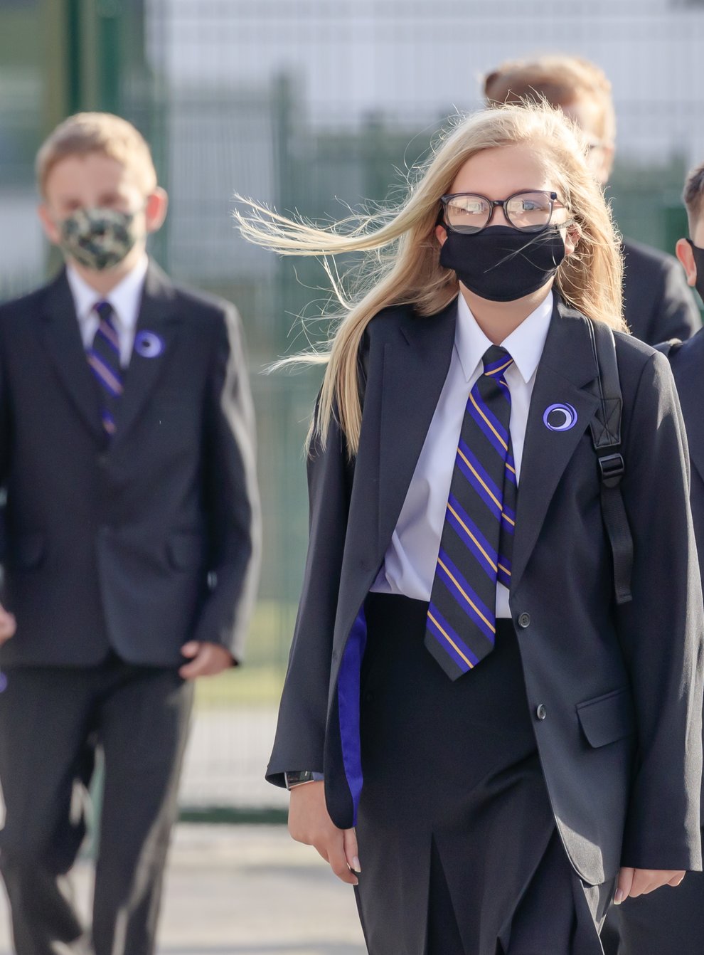 Pupils wearing protective face masks