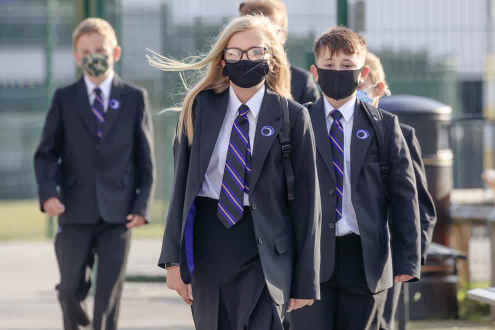 Pupils wearing protective face masks