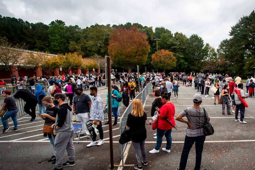 Hundreds of people wait for early voting in Marietta, Georgia
