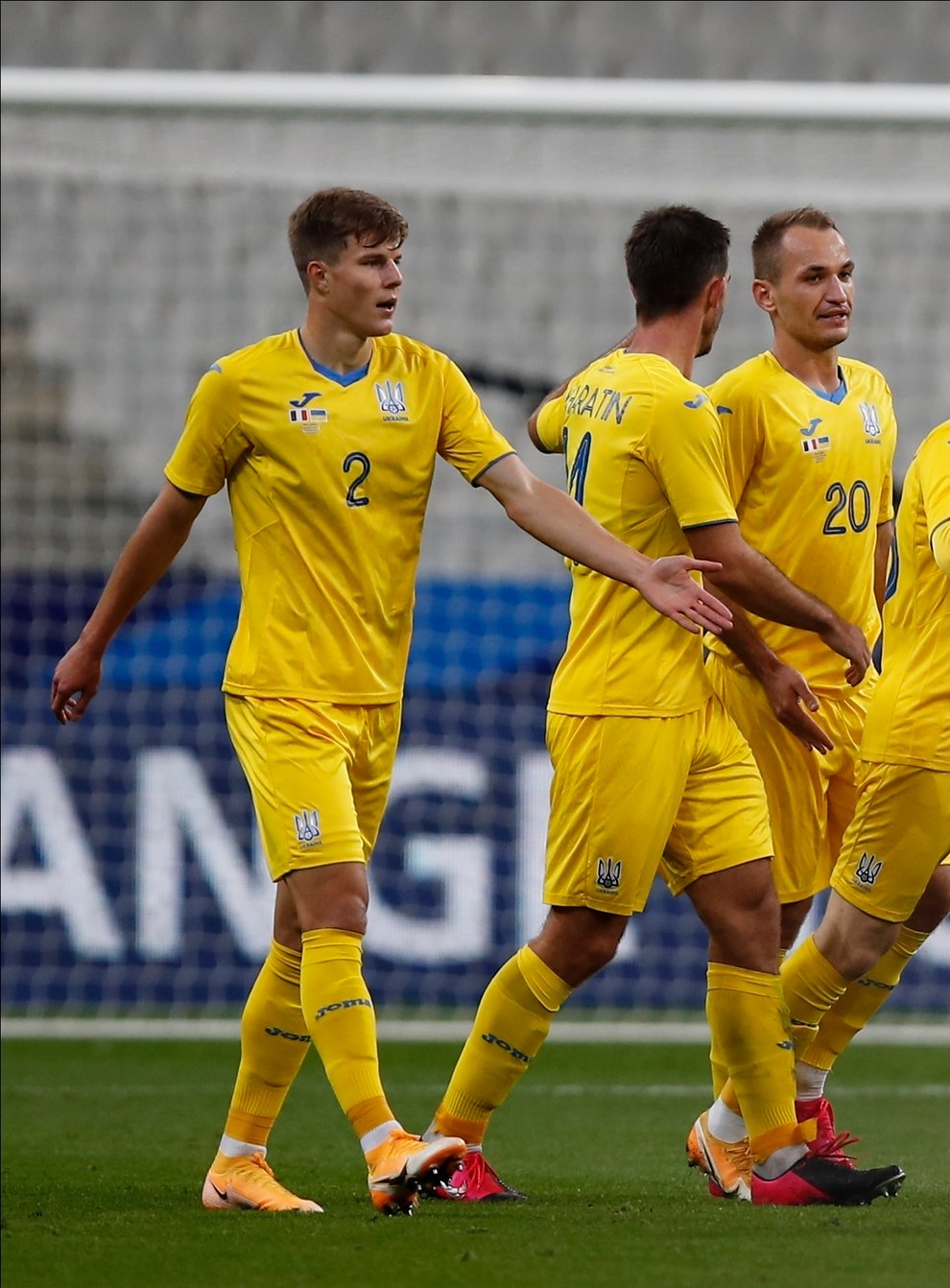Viktor Tsygankov (second right) celebrates Ukraine's winner over Spain.