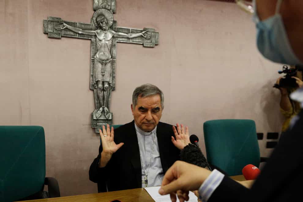 Cardinal Angelo Becciu talks to journalists (Gregorio Borgia/AP)