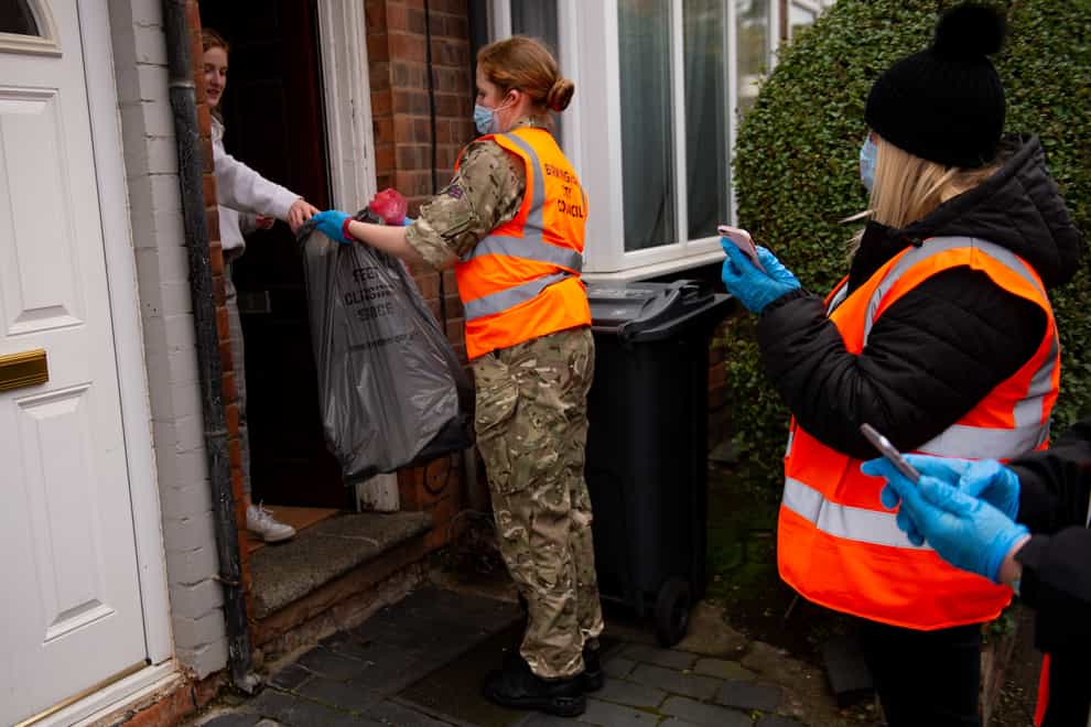 RAF personnel help with a coronavirus test distribution system