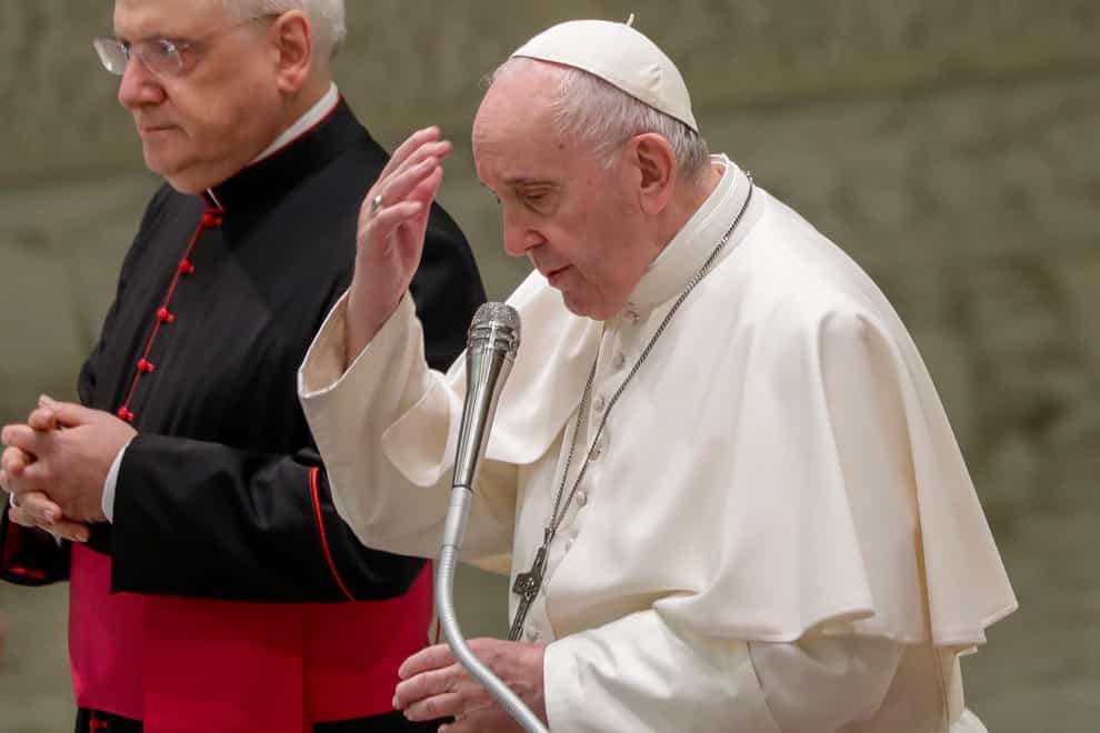 Pope Francis makes the sign of the cross (Andrew Medichini/AP)