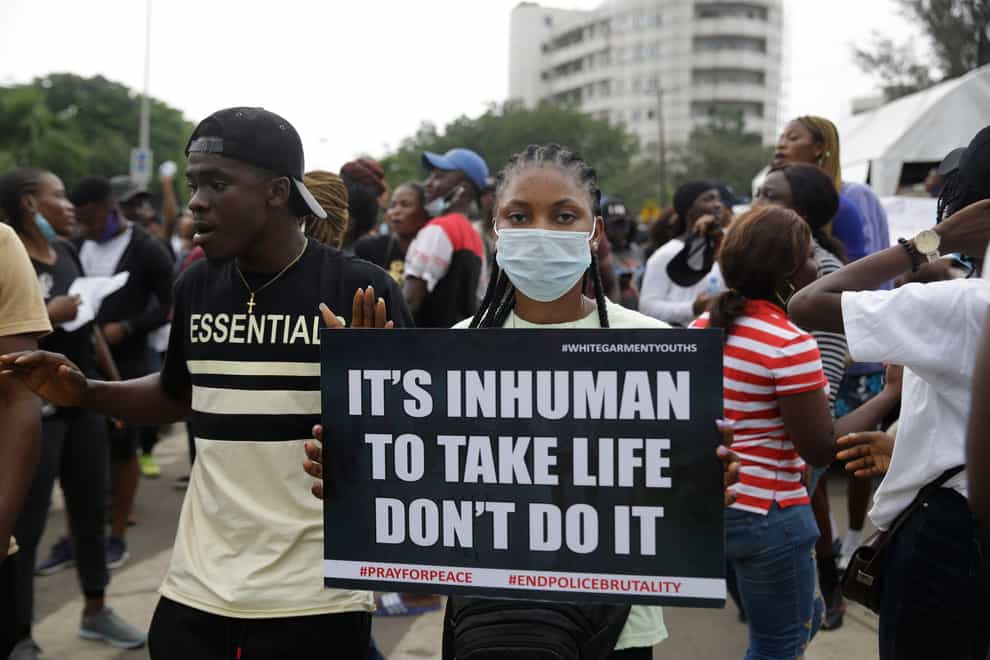 People demonstrate on the street to protest against police brutality in Lagos, Nigeria (Sunday Alamba/AP)