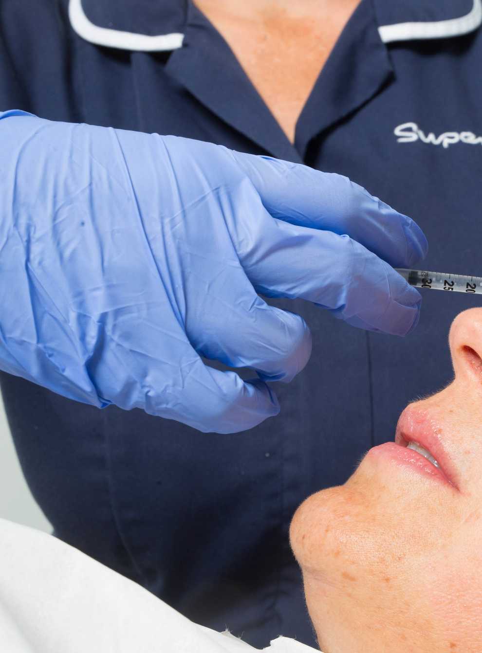 A woman undergoes treatment with Superdrug's Skin Renew Service