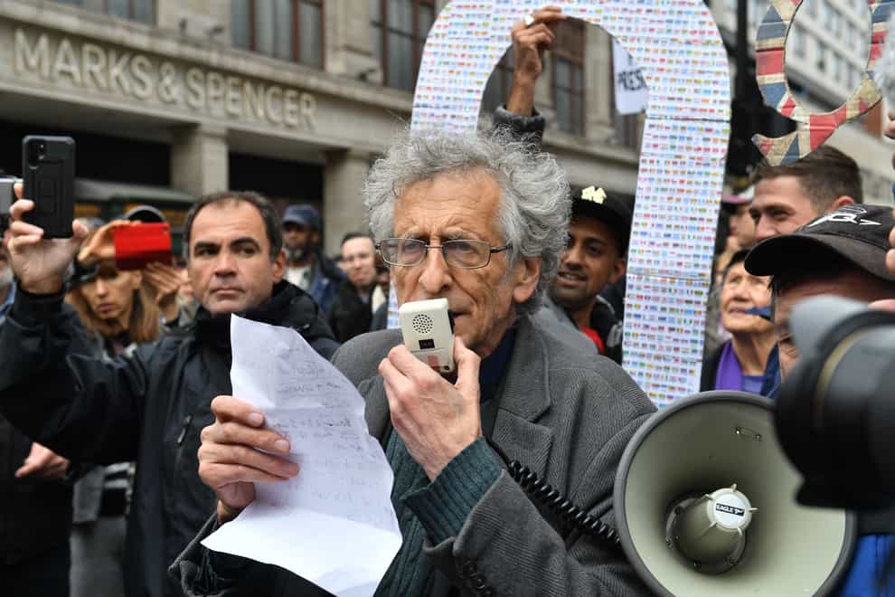 The brother of former Labour leader Jeremy Corbyn, Piers Corbyn, speaks to protesters during an anti-lockdown rally on Oxford Street, London (Dominic Llipinski/PA)