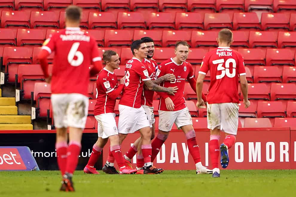 Barnsley’s Cauley Woodrow (second right) celebrates his late equaliser