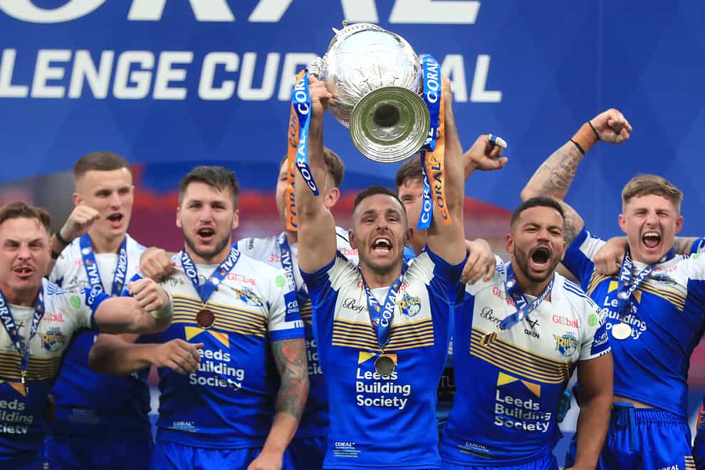 Leeds Rhinos’ Luke Gale lifts the trophy