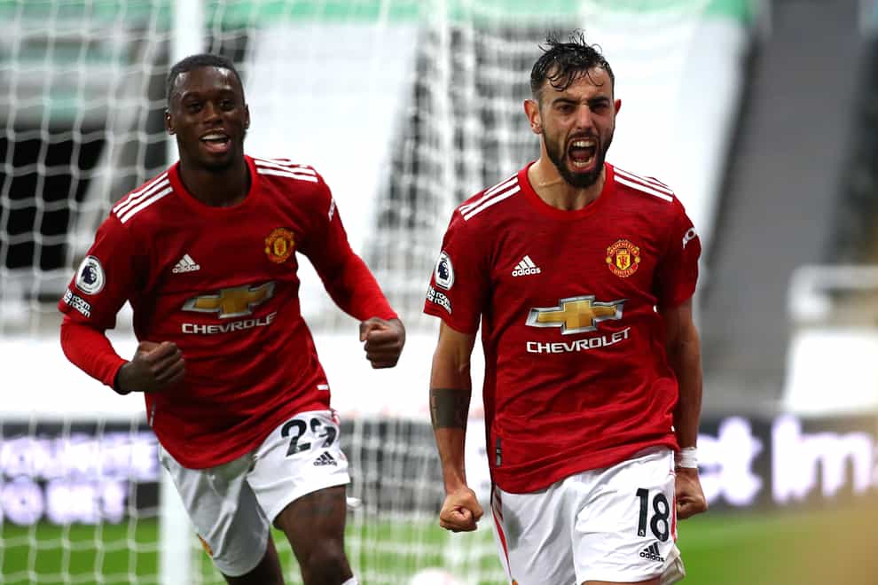 Manchester United’s Bruno Fernandes (right) celebrates his goal at Newcastle