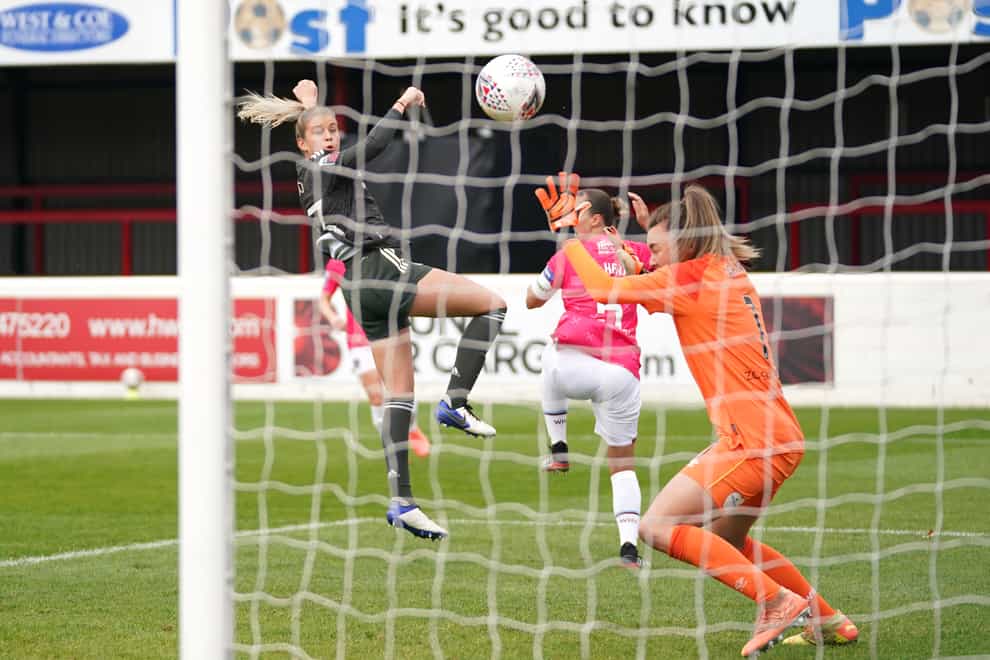 Manchester United's Alessia Russo (left) scores her side's third goal of the game 