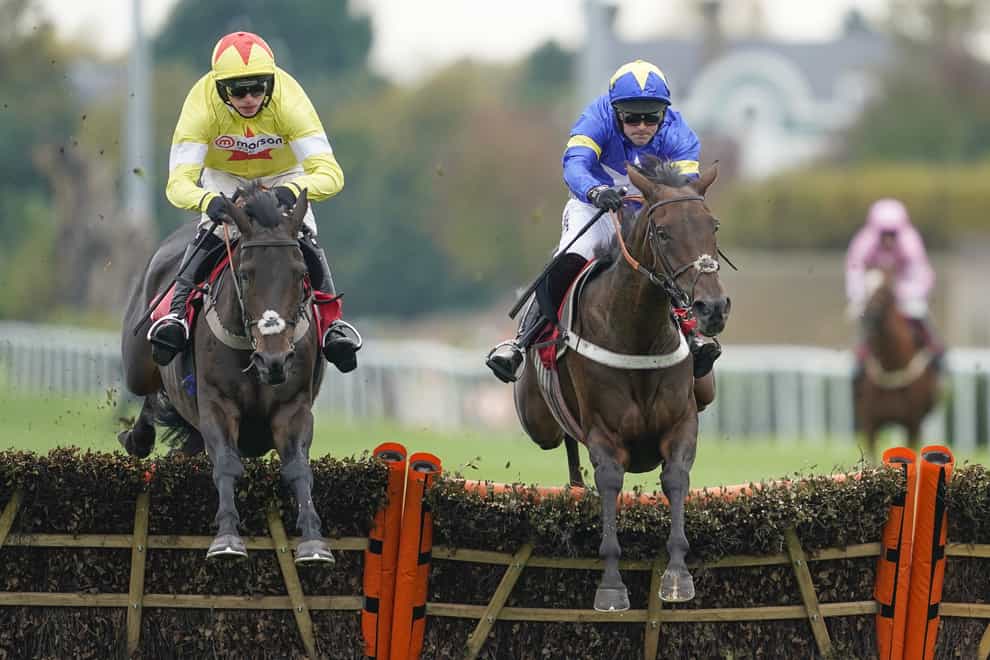 Mrs Hyde, ridden by Nico de Boinville (right), clears the last to win the Racing TV Novices’ Hurdle at Kempton