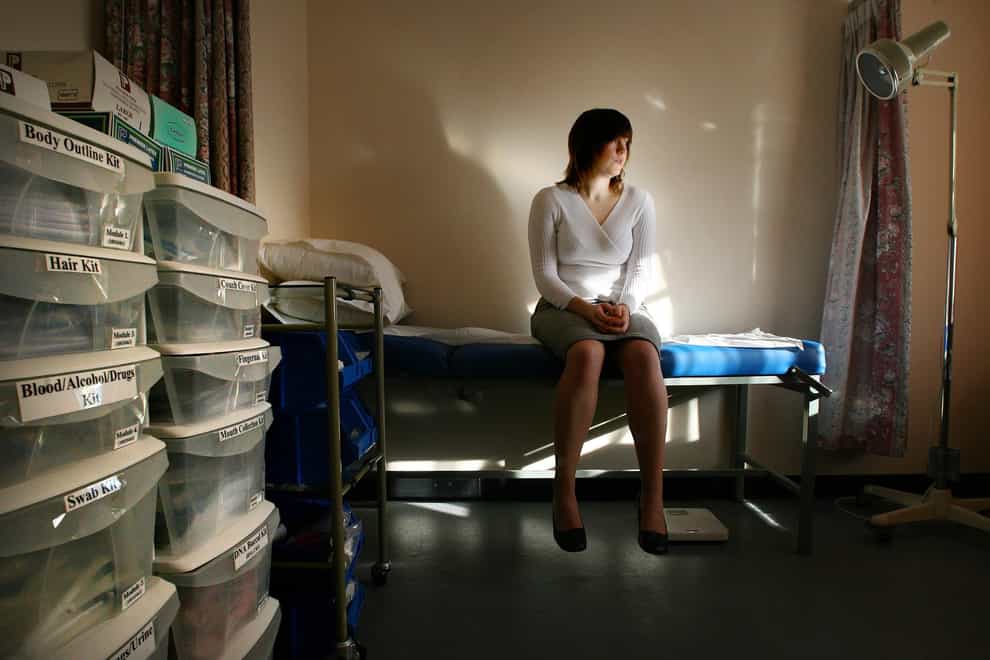 Woman waits in doctor's surgery