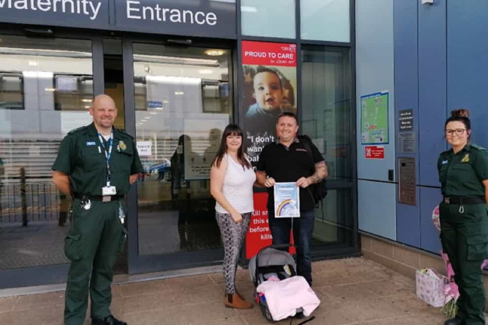 Gemma Greensmith, centre, is reunited with the West Midlands Ambulance Service team who helped after she gave birth to her daughter