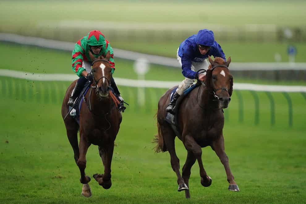 Act Of Wisdom (right) on the way to victory at Newmarket