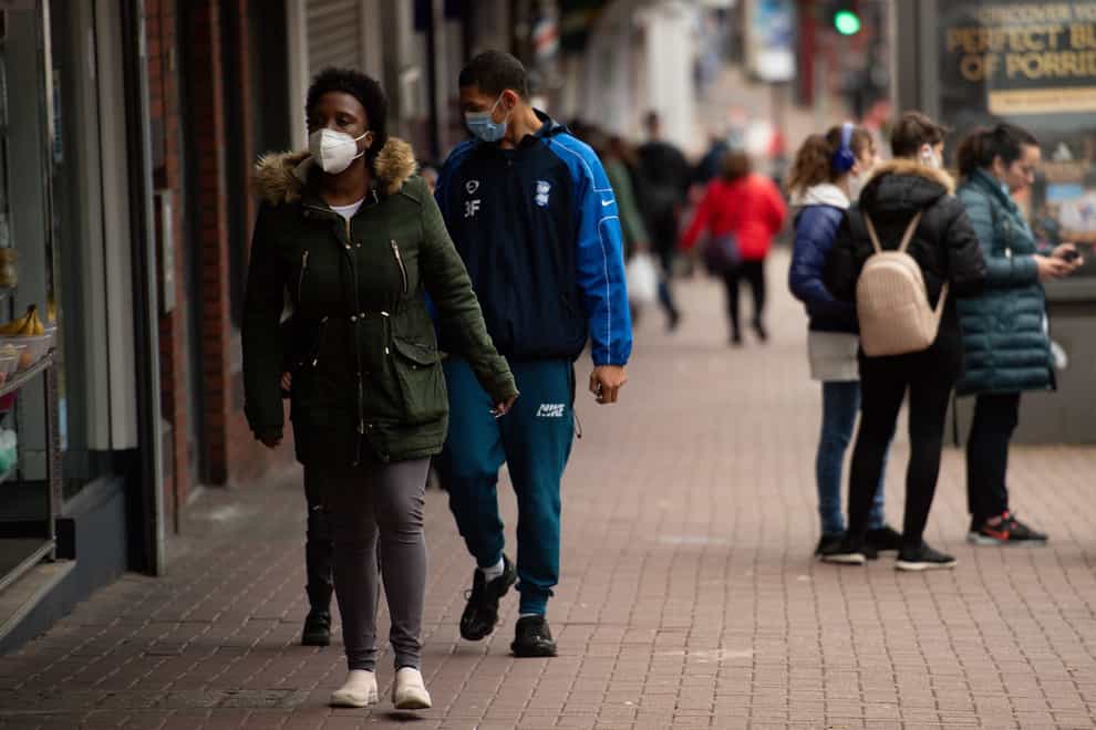 Shoppers wearing protective face masks