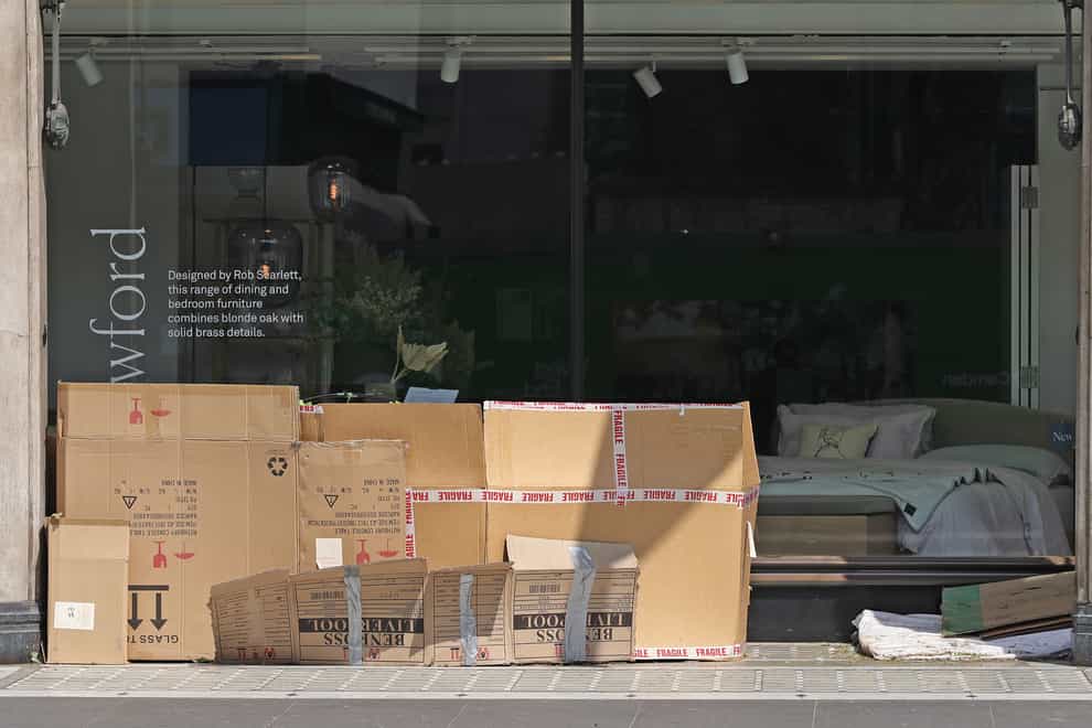 A cardboard homeless shelter outside a furniture store in Tottenham Court Road, London (Yui Mok/PA)