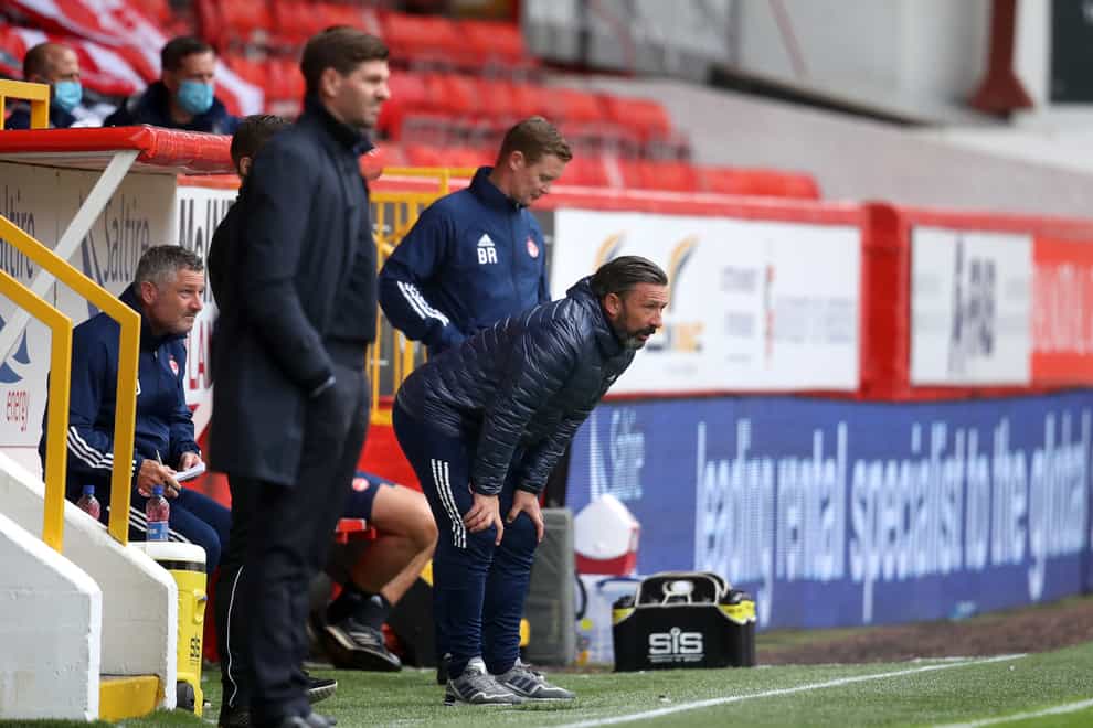 Derek McInnes (centre) admits Aberdeen missed an opportunity to test Rangers on the opening day of the season