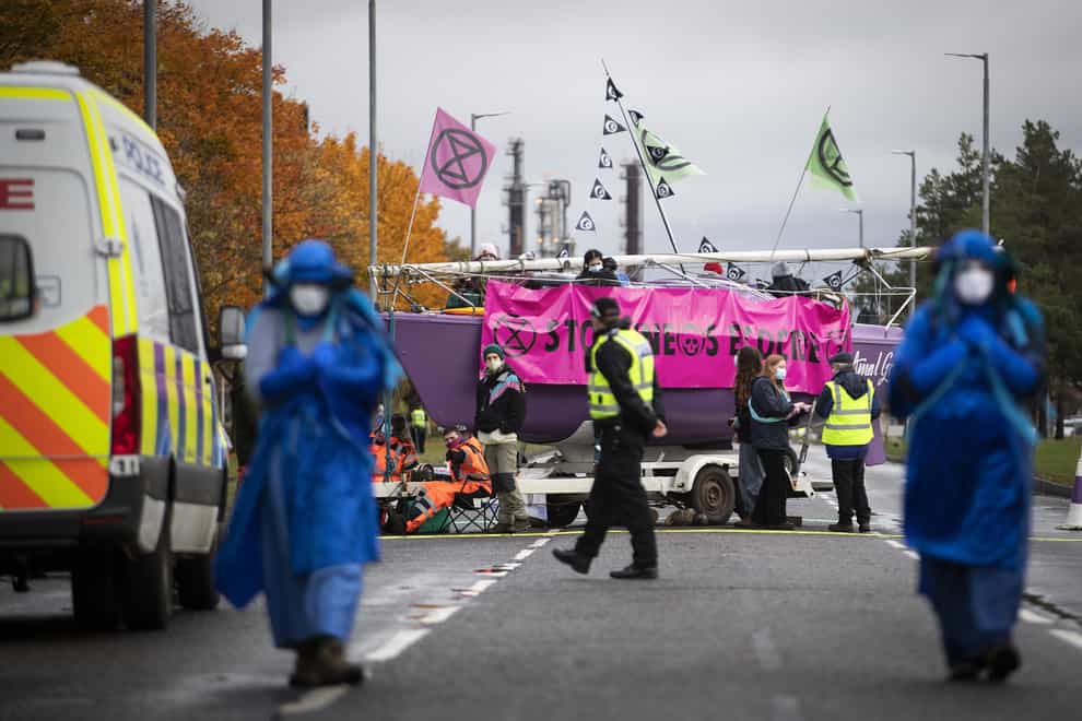 Extinction Rebellion Scotland blockades the road with a boat