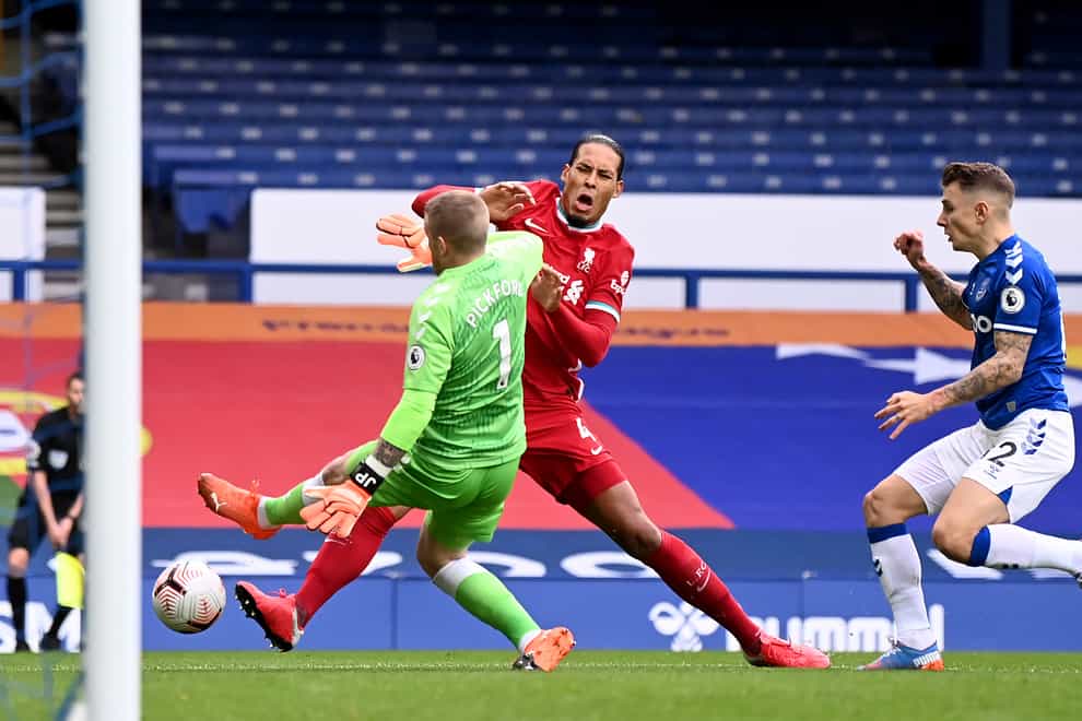 Liverpool defender Virgil Van Dijk (centre) is set for an extended spell on the sidelines