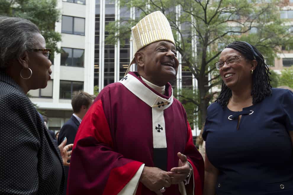 Washington DC Archbishop Wilton Gregory greets churchgoers at St Mathews Cathedral