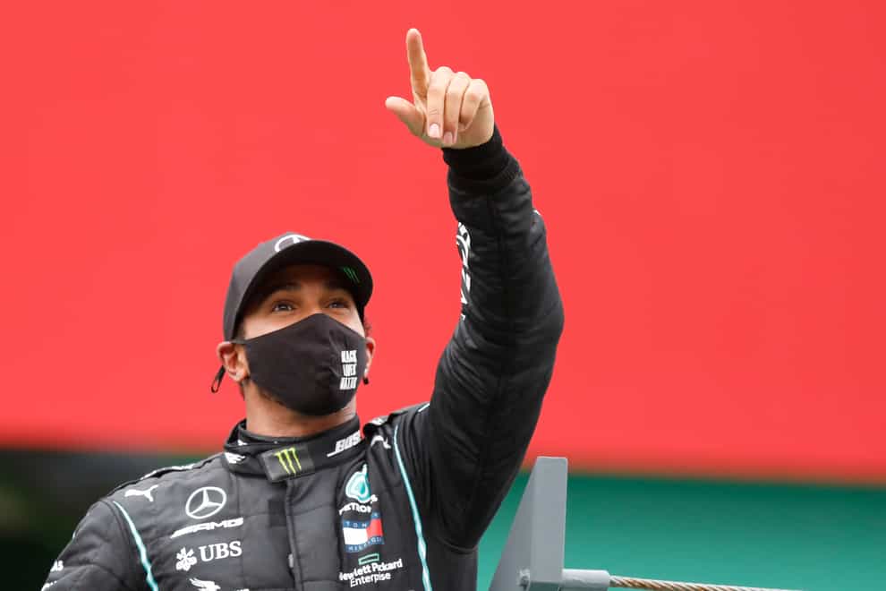 Lord Hain says it is 'unacceptable' that Lewis Hamilton, pictured celebrating the Portuguese Grand Prix victory that gave him a record 92 F1 race wins, has yet to be knighted.