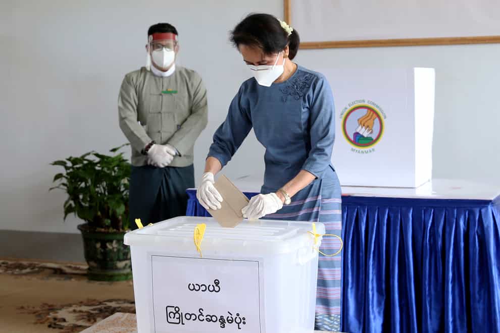 Burma’s leader Aung San Suu Kyi casts an early vote for the upcoming November 8 general election (Aung Shine Oo/AP)