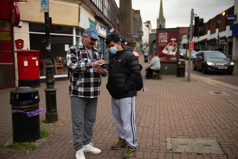 Shoppers wearing protective face masks in Dudley, in the West Midlands (Jacob King/PA)
