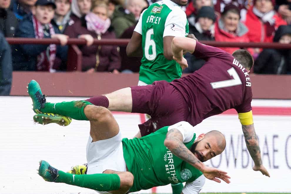 Hearts’ Jamie Walker is tackled by Hibernian’s Liam Fontaine in a Scottish Cup tie