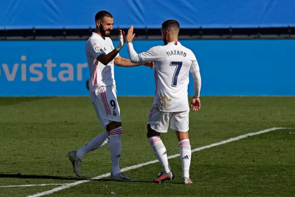 Karim Benzema (left) scored twice against Huesca, while Eden Hazard scord his first Real Madrid goal in a year (Manu Fernandez/AP).