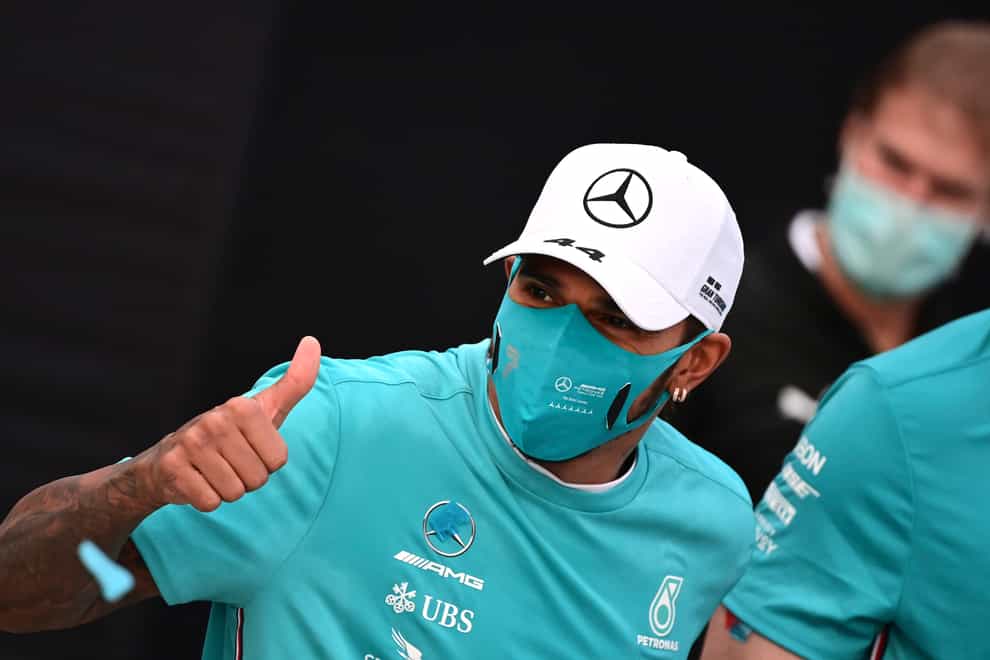 Lewis Hamilton, gives the thumbs up as he celebrates winning the Emilia Romagna Grand Prix but says he cannot guarantee racing on in 2021