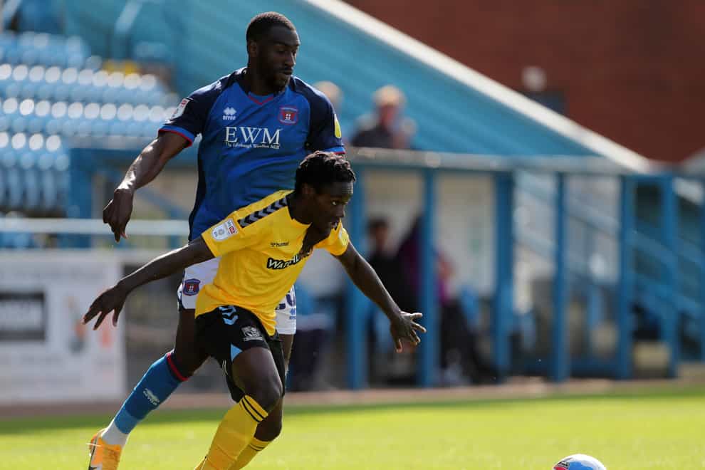 Gime Toure (left) is suspended for Carlisle