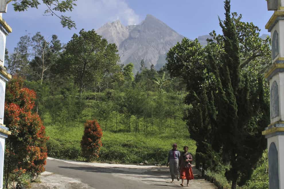 Mount Merapi is seen in the background in Pemalang, Central Java, Indonesia (Agung Nugroho/AP)