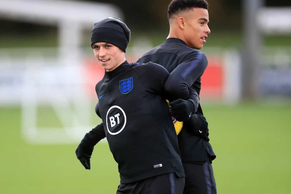 Phil Foden, left, has been recalled by Gareth Southgate but Mason Greenwood misses out for England
