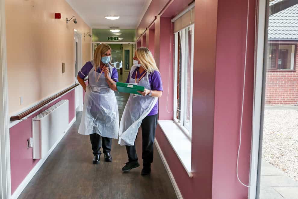 Staff in PPE in a care home
