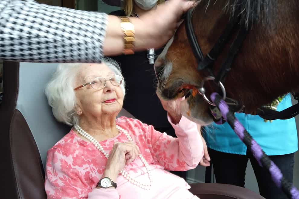 A Covid-19 survivor celebrates her 100th birthday in a care home