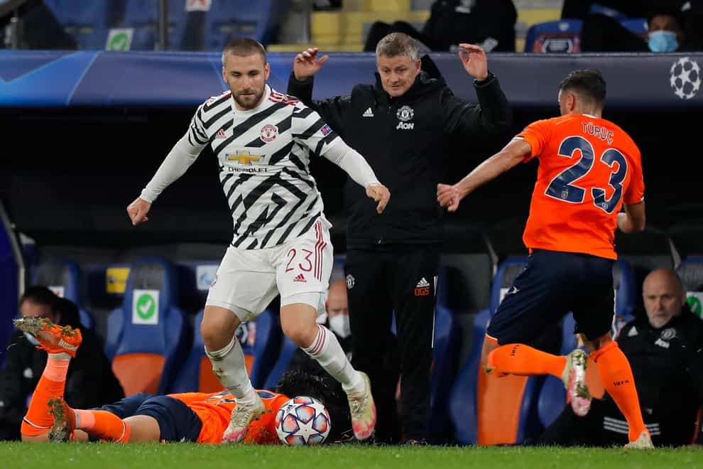 Ole Gunnar Solskjaer gestures as Manchester United’s Luke Shaw fights for the ball
