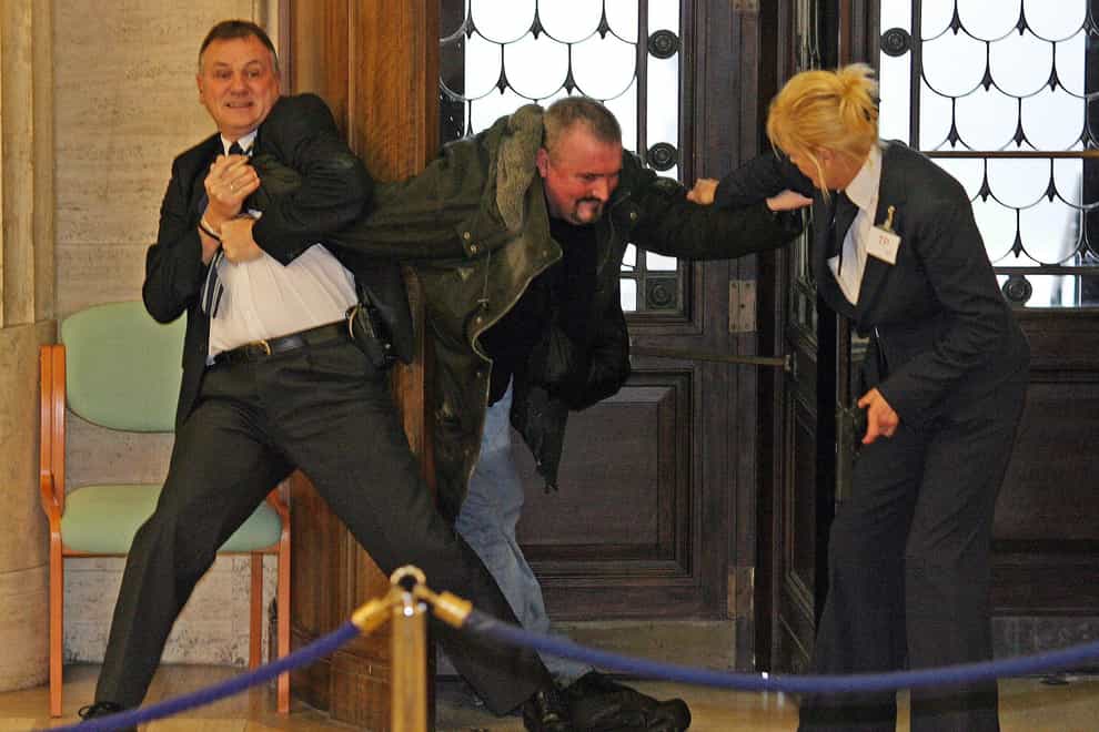 Michael Stone tackled at Stormont