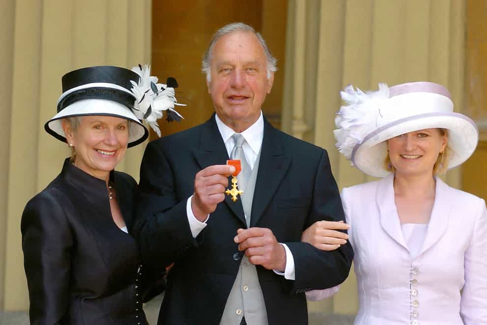 Geoffrey Palmer with his wife Sally and daughter Harriet as he collects his OBE